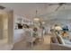 Dining area connected to living room, featuring a glass table and mirrored wall at 2131 Ridge S Rd # 132, Largo, FL 33778