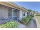 Attractive exterior featuring a screened-in porch with comfortable seating and vibrant plants at 2131 Ridge S Rd # 132, Largo, FL 33778