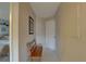 Inviting hallway featuring a wooden bench and neutral decor for a warm welcome at 2131 Ridge S Rd # 132, Largo, FL 33778