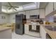 Bright kitchen with modern appliances, white cabinets, and an adjacent breakfast nook that enhances the open feel at 2131 Ridge S Rd # 132, Largo, FL 33778