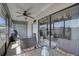Relaxing screened-in lanai featuring comfortable seating and ceiling fan for outdoor enjoyment at 2131 Ridge S Rd # 132, Largo, FL 33778