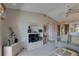 Cozy living room features neutral tones, comfortable seating, and a mounted television with entertainment center at 2131 Ridge S Rd # 132, Largo, FL 33778