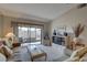 Open living room with a sliding glass door to the patio and entertainment center at 2131 Ridge S Rd # 132, Largo, FL 33778