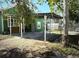 Backyard patio area with green home at 2410 Harper St, Tampa, FL 33605