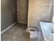 Bathroom features tiled walls and sink at 2410 Harper St, Tampa, FL 33605