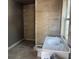 Bathroom features tiled walls, toilet, and sink at 2410 Harper St, Tampa, FL 33605