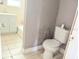 Bathroom features a toilet, vanity with sink, and neutral wall color at 2410 Harper St, Tampa, FL 33605