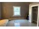 Bedroom with a window and neutral-colored walls at 2410 Harper St, Tampa, FL 33605