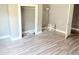 Bedroom featuring hardwood flooring, a window, and a closet at 2410 Harper St, Tampa, FL 33605