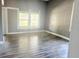 Bedroom featuring hardwood flooring and a window at 2410 Harper St, Tampa, FL 33605
