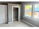 Bedroom featuring tile flooring, a window, and closet at 2410 Harper St, Tampa, FL 33605