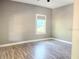 Bedroom featuring hardwood flooring and a window at 2410 Harper St, Tampa, FL 33605