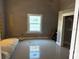 Bedroom with a window and neutral-colored walls at 2410 Harper St, Tampa, FL 33605
