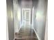 Hallway featuring hardwood flooring and white trim at 2410 Harper St, Tampa, FL 33605