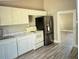 Kitchen with marble counter tops and stainless steel refrigerator at 2410 Harper St, Tampa, FL 33605