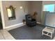 Cozy living room featuring a recliner and decorative mirror, creating a relaxed atmosphere at 2410 Harper St, Tampa, FL 33605