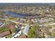 Aerial view of the neighborhood shows the property's location near a lake at 2576 Laurelwood Dr # 13C, Clearwater, FL 33763