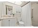 Bright bathroom features a shower with tub, white cabinets and neutral decor at 2576 Laurelwood Dr # 13C, Clearwater, FL 33763