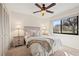 Cozy bedroom features a ceiling fan, natural light and neutral decor at 2576 Laurelwood Dr # 13C, Clearwater, FL 33763