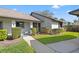 Charming single-story home featuring a well-maintained lawn and sidewalk leading to the front door at 2576 Laurelwood Dr # 13C, Clearwater, FL 33763