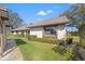 Well-maintained exterior view shows manicured landscaping and mature trees at 2576 Laurelwood Dr # 13C, Clearwater, FL 33763