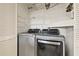 Convenient laundry room features stainless steel washer and dryer at 2576 Laurelwood Dr # 13C, Clearwater, FL 33763