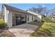 A brick patio adjacent to sliding glass doors offers outdoor living space at 2576 Laurelwood Dr # 13C, Clearwater, FL 33763