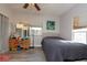 Cozy bedroom with grey wood flooring and bright natural light at 313 Jefferson S Ave, Oldsmar, FL 34677