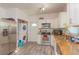 A kitchen with stainless steel appliances, granite countertops, and laundry area at 313 Jefferson S Ave, Oldsmar, FL 34677