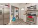 Kitchen featuring stainless steel appliances and stacked washer/dryer at 313 Jefferson S Ave, Oldsmar, FL 34677