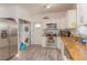 This kitchen features stainless steel appliances, granite counters, and a laundry area at 313 Jefferson S Ave, Oldsmar, FL 34677