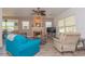 Spacious living room with natural light, neutral tones, a decorative fireplace, and comfortable seating at 313 Jefferson S Ave, Oldsmar, FL 34677