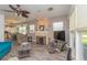 Open living room with a stone fireplace, wood floors, and a bright, airy atmosphere at 313 Jefferson S Ave, Oldsmar, FL 34677
