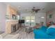 Cozy living room featuring a stone fireplace, wood floors, and comfortable seating at 313 Jefferson S Ave, Oldsmar, FL 34677