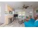 Comfortable living room with a stone fireplace, wood floors, and cozy seating arrangement at 313 Jefferson S Ave, Oldsmar, FL 34677