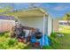 Outdoor shed with an open carport in the backyard, offering extra storage space at 313 Jefferson S Ave, Oldsmar, FL 34677