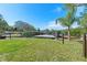 The home features a backyard with a wooden deck perfect for entertaining at 3327 Pineview Dr, Holiday, FL 34691