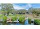 Spacious backyard with private dock and mature trees at 3327 Pineview Dr, Holiday, FL 34691