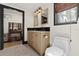 Inviting bathroom featuring a double vanity, stylish mirrors, and fixtures, blending comfort and sophistication at 3327 Pineview Dr, Holiday, FL 34691