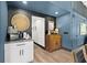 Hallway features coffee bar, wood accents, contrasting wall color, and natural decor accents at 3327 Pineview Dr, Holiday, FL 34691