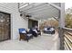Covered deck area with wicker seating, coffee table, and overhead heater at 3327 Pineview Dr, Holiday, FL 34691