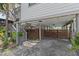 View of ground-level covered parking and a driveway at 3327 Pineview Dr, Holiday, FL 34691