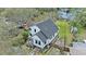 Exterior elevation of a bright home featuring a metal roof at 3327 Pineview Dr, Holiday, FL 34691