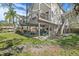 Charming two-story home with a spacious backyard perfect for outdoor activities and gatherings at 3327 Pineview Dr, Holiday, FL 34691