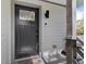 Inviting front door featuring a glass accent and modern black hardware, and a Ring doorbell for added security at 3327 Pineview Dr, Holiday, FL 34691