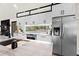 Well-appointed kitchen featuring stainless steel appliances, white cabinets, and a large island for meal prep at 3327 Pineview Dr, Holiday, FL 34691