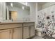 Modern bathroom showcasing a double vanity with granite countertops and pendant lighting at 34110 Jasper Stone Dr, Wesley Chapel, FL 33543