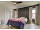 Bedroom with a decorative headboard, soft lighting, and neutral tones, creating a serene retreat at 34110 Jasper Stone Dr, Wesley Chapel, FL 33543