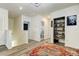 Hallway with wood flooring and doorways leading to bathroom and other rooms at 34110 Jasper Stone Dr, Wesley Chapel, FL 33543