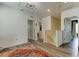 Hallway with wood flooring, an overhead light fixture, and doorways leading to other rooms at 34110 Jasper Stone Dr, Wesley Chapel, FL 33543